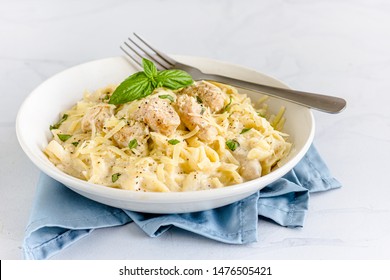 Chicken Alfredo Pasta In A White Bowl