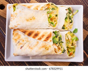 Chicken, Avocado, Cilantro And Cheese Burritos. View From Above, Top Studio Shot