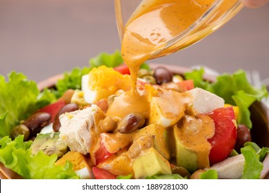 Chicken, Avocado And Tomato Cobb Salad On The Table