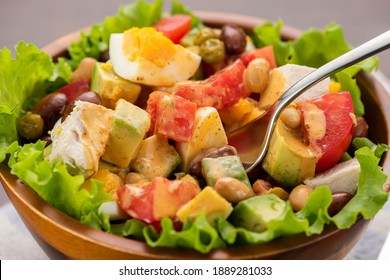 Chicken, Avocado And Tomato Cobb Salad On The Table