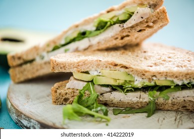 Chicken and avocado wholegrain bread sandwich triangles