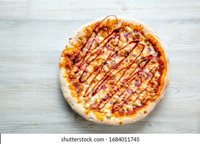 Chicken BBQ Pizza. Pizza Sauce, Mozzarella, Chicken Breast, Bacon, Red Onion, BBQ Sauce, Traditional Pastry