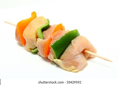 Chicken, Bell Pepper Shish Kabob Raw Over White.