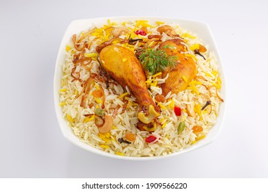 Chicken biryani , kerala style chicken dhum biriyani made using jeera rice and spices arranged in a white ceramic table ware with white background, isolated