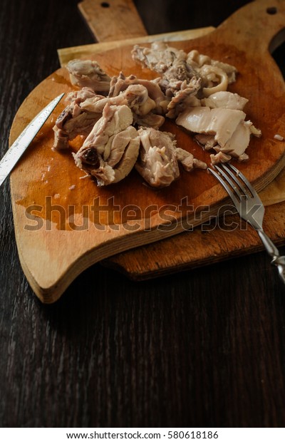 Chicken boiled meat taken apart on the kitchen\
blackboard\
cook 