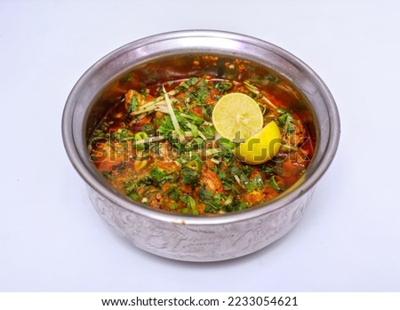 chicken boneless handi with lemon slice served in dish isolated on grey background top view of pakistani food