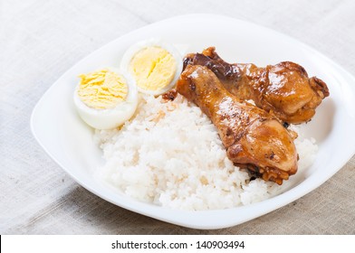 chicken braised in soy sauce, vinegar pepper and bay leaves/chicken adobo with eggs