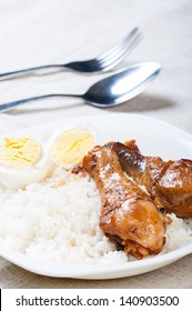 chicken braised in soy sauce, vinegar pepper and bay leaves/chicken adobo with eggs