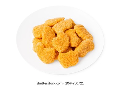 Chicken breaded nuggets on a white plate.Close-up Many slices of breaded inner fillet, sliced on a white background. Raw chicken fillet inner, sprinkled with bright breading.