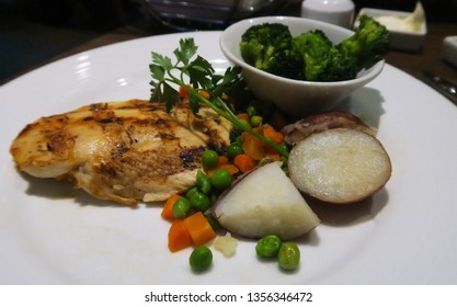 Chicken Breast with Broccoli potatoes and peas and carrots