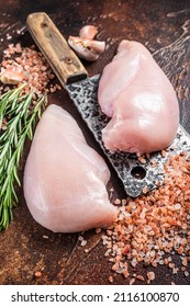 Chicken Breast Fillet, Fresh Raw Poultry Meat On Butcher Cleaver. Dark Wooden Background. Top View