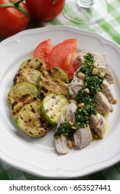 Chicken Breast With Pesto Sauce, Roasted Summer Squash, And Sliced Tomato