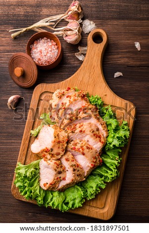 chicken breast sous-vide, Sous Vide chicken fillet on green lettuce leaves top view, flat lay