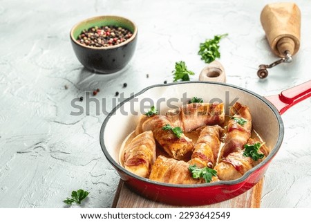 chicken breast wrapped with bacon in pan. Healthy fats, clean eating for weight loss. place for text, top view.