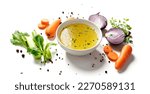 Chicken broth, stock or bouillon with vegetables isolated on white background