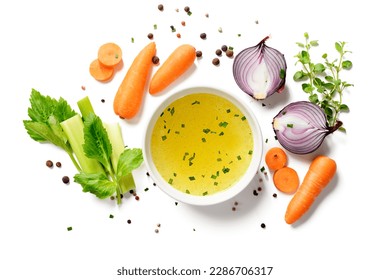 Chicken broth, stock or bouillon with vegetables isolated on white background. top view - Powered by Shutterstock