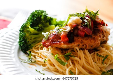 Chicken Bruschetta And Pasta On White Plate 