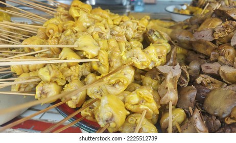 Chicken brutu or chicken butt that has been seasoned and ready to be fried which is sold using skewers at street food centers - Shutterstock ID 2225512739