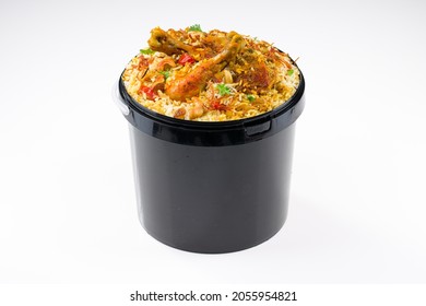 Chicken Bucket Biryani, Kerala Dum Chicken Biryani Arranged In A Black Bucket Container With White Textured Background.