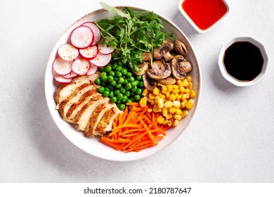 Chicken Buddha Bowl With Meat, Colorful Vegetables On Base Of Brown Rice.