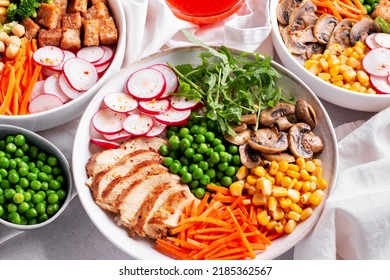 Chicken Buddha Bowl With Meat, Colorful Vegetables On Base Of Brown Rice.