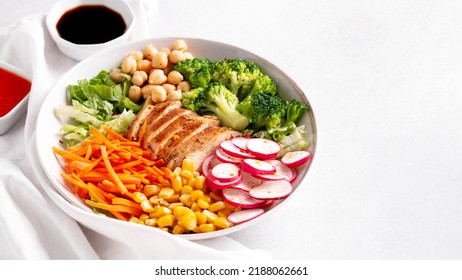 Chicken Buddha Bowl With Meat, Colorful Vegetables On Base Of Brown Rice.