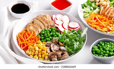 Chicken Buddha Bowl With Meat, Colorful Vegetables On Base Of Brown Rice.