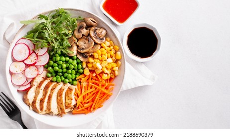 Chicken Buddha Bowl With Meat, Colorful Vegetables On Base Of Brown Rice.