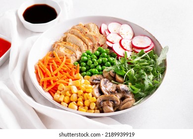 Chicken Buddha Bowl With Meat, Colorful Vegetables On Base Of Brown Rice.