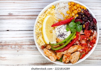 Chicken Buddha Bowl On Rustic Whitewashed Wooden Table With Copy Space