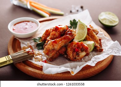 Chicken Buffalo Grill Wing Spicy Food Plate. American Roasted Crispy Meat Platter With Red Spice Sauce, Lime And Carrot. Pub And Bar Grilled Lunch Snack Horizontal Side View For Menu