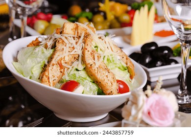 Chicken Caesar salad bowl on table - Powered by Shutterstock