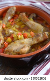 Chicken Cassoulet In A Pot On A Rustic Table