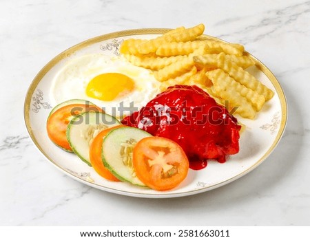 Chicken chop, sunny side up egg Egg, loaded fries, fresh cucumber and tomato slices served in plate isolated on marble background side view of singapore breakfast food