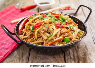 Chicken chow mein a popular oriental dish with noodles and vegetables - Shutterstock ID 460860631