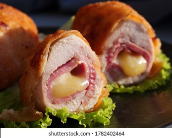 Chicken cordon bleu schnitzel, meat wrapped around ham and cheese, breaded and fried.