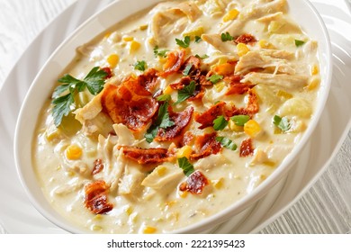 Chicken Corn Chowder, Rich And Creamy Soup Made With Tender Rotisserie Chicken Breast, Hearty Potatoes, Sweet Corn, Topped With Fried Crispy Bacon And Fresh Parsley In White Bowl, Close-up