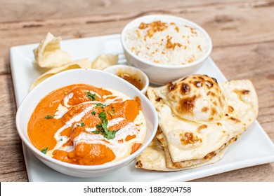 Chicken Curry Indian Dish With Naan Bread And Rice