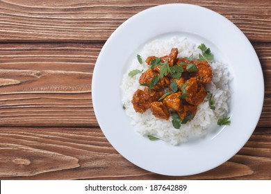 Chicken Curry With Rice And Cilantro On A Plate Horizontal Top View 