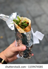 Chicken Curry Wrap With Salad Wrapped In Foil From A Street Food Market