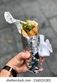 Chicken Curry Wrap With Salad Wrapped In Foil From A Street Food Market