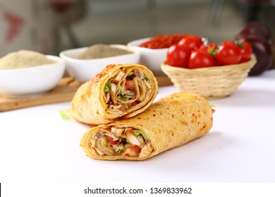 Chicken doner kebab and fresh vegetables in roll of pita bread lavash - Durum Chicken Doner Kebab