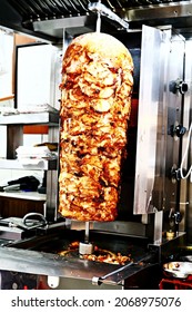 Chicken Doner Kebab. Traditional Turkish Fast Food. Delicious Chicken Kebab Turns Around The Fire.