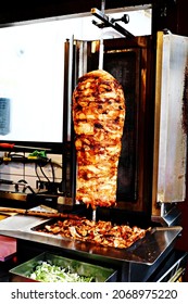 Chicken Doner Kebab. Traditional Turkish Fast Food. Delicious Chicken Kebab Turns Around The Fire.
