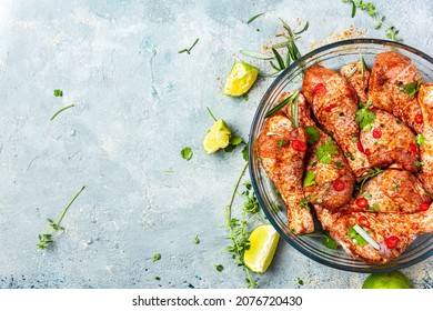 Chicken Drumstick Legs MArinated In HErbs And SPices For BBQ. Top View Background.