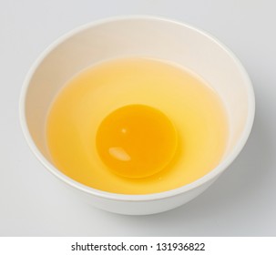 Chicken Egg Yolk In White Small Bowl