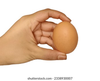 Chicken eggs being cracked to break the eggshells for cooking - Powered by Shutterstock