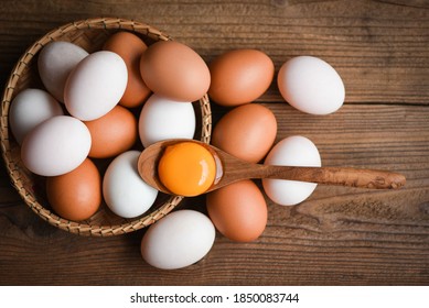Chicken eggs and duck eggs collect from farm products natural in a basket healthy eating concept / Fresh broken egg yolk