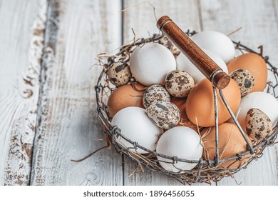 Chicken eggs hanging in an old traditional basket of metal-wire. - Powered by Shutterstock