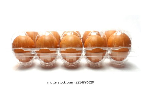 Chicken Eggs In Plastic Egg Tray On A White Background.